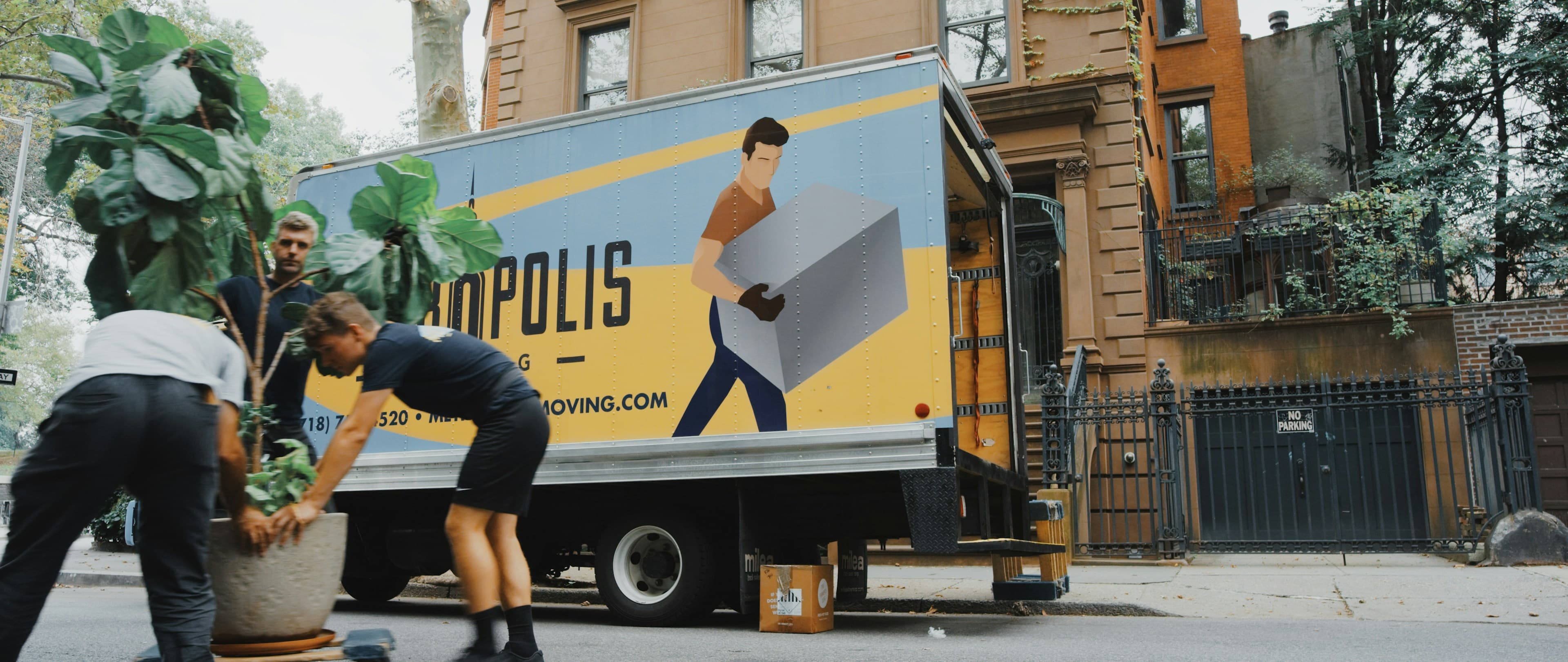 IVAT packers and movers crew carefully loading furniture onto a truck for a house shifting in Delhi NCR